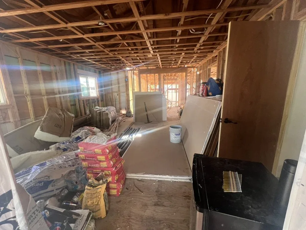 Framed living room, new windows, and can lights.