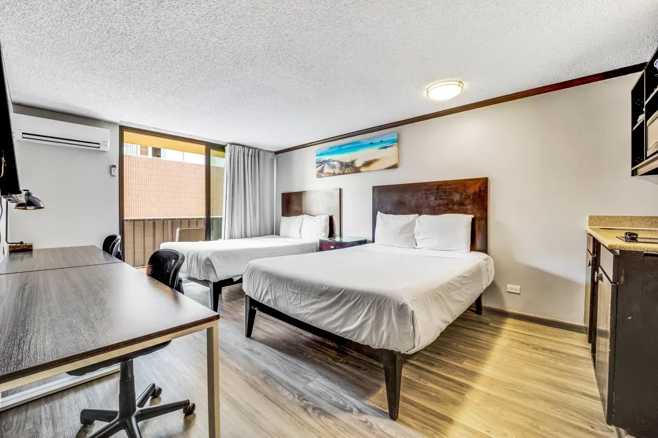 New luxury vinyl flooring throughout the Waikīkī studio for a modern, easy-to-maintain finish.